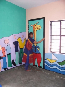 Our volunteer and play leader adds a friendly touch to house walls